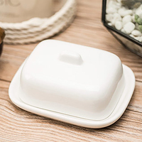 Nouvelle conception de beurrier en céramique, beurrier en céramique blanc avec couvercle
