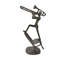 Sculpture abstraite en fonte de tromboniste sur chaise, figurine d'artiste, décoration artistique pour la maison et le bureau, artisanat très vendu