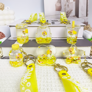 Llavero de acrílico flotante con diseño de dibujos animados de bebé durazno amarillo, con purpurina líquida, para <span class=keywords><strong>mochila</strong></span>/bolso/coche, bonito - Product Image 1