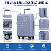 Valise rigide PP grise à roulettes, coque géométrique, poignée latérale, marque privée, assortiment de détail