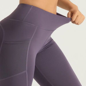 Pantaloni da Yoga a vita alta con Logo di colore personalizzato per le <span class=keywords><strong>gambe</strong></span> Push up con tasche a rete laterali senza cuciture pantaloni da ginnastica a 7 punti - Product Image 1