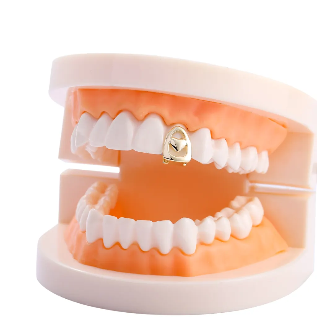 Hiphop 14k placcato oro denti a cuore singolo Grillz New Hollow Top denti griglie per uomo Halloween cosmetici griglie dentali