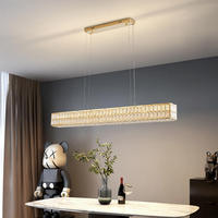 Lustre long en cristal moderne et minimaliste de luxe, idéal pour les restaurants haut de gamme, les tables à manger et les comptoirs de bar