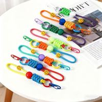 Porte-clés en paracorde tressé coloré, cordons de poignet en corde avec anneau à ressort, breloques de sac à main tissées à la main pour sacs à main