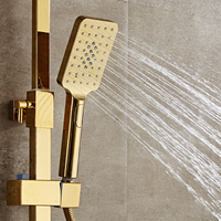Ensemble de douche thermostatique mural avec bouton rond, poignée carrée dorée et pistolet de pulvérisation