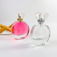 Flacon de parfum en verre épais rond personnalisé de 30 ml, 50 ml, 100 ml avec bouchon noir, pompe à pression anti-fuite, impression sérigraphique