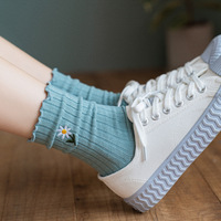 Nouvelle broderie marguerite fleur fille chaussettes Simple couleur unie Kawaii heureux drôle équipage longueur femmes chaussettes avec Logo sur la manchette du corps