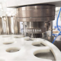 Machine de remplissage et de sertissage automatique de parfum à 4 buses, équipement de mise en bouteille d'huile essentielle avec système d'étanchéité en feuille d'aluminium