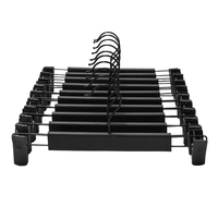 Cintres réglables antirouille à double niveau pour pantalons noir PP armoire salle de bain cintres durables pratiques pour jupes pantalons