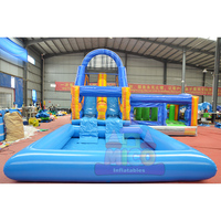 Grand château gonflable arc-en-ciel avec toboggan aquatique double piste et piscine, usage commercial, grande capacité, pour fêtes d'enfants