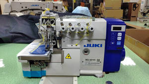 Machine à coudre industrielle d'occasion JUKI MO-6814D à entraînement direct, surjeteuse 4 fils avec coupe-fil automatique - Product Image 3