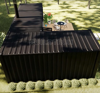 Conteneur d'expédition modulaire noir en forme de L 20 pieds Studio espace de travail confortable avec chambre à coucher au Canada