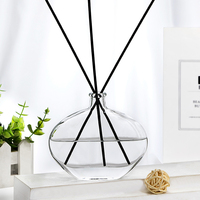 Flacon de parfum en verre transparent de forme ovale OEM ODM 120 ml avec bouchon diffuseur d'arômes Flacon vide