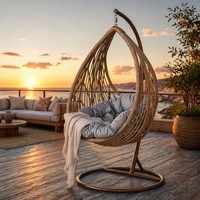 Fauteuil suspendu moderne en rotin PE avec structure en fer, imperméable et robuste, pour balcon et cour extérieurs, vente en gros