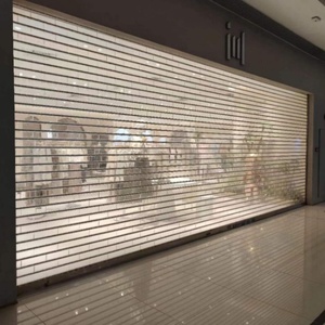 Porte à enroulement moderne de qualité industrielle transparente |   Construction robuste motorisée |   Anti-vol |   Pour les points d'accès des entrepôts, des centres commerciaux et des hôtels - Product Image 1