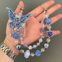 Breloque de téléphone papillon bleu foncé avec gros strass et perles, lanière de poignet pour sac, bijou artisanal lourd, cadeau pour femme