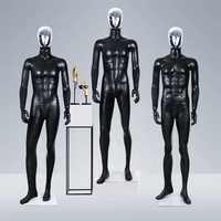 Mannequin masculin musclé en fibre de verre, corps entier noir mat, visage argenté chromé, pour présentation de costumes d'affaires
