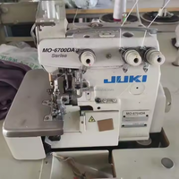 Machine à coudre surjeteuse industrielle Juki 6704DA d'occasion à une aiguille, idéale pour la confection de chemises – Offre Spéciale