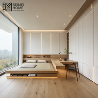 Lit plateforme tatami fonctionnel Bauhaus sur mesure avec armoire de rangement modulaire intégrée pour appartement moderne