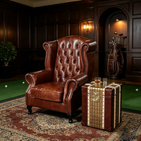Fauteuil Chesterfield vintage à dossier haut en cuir véritable capitonné, idéal pour hôtel, villa, salle de cigares