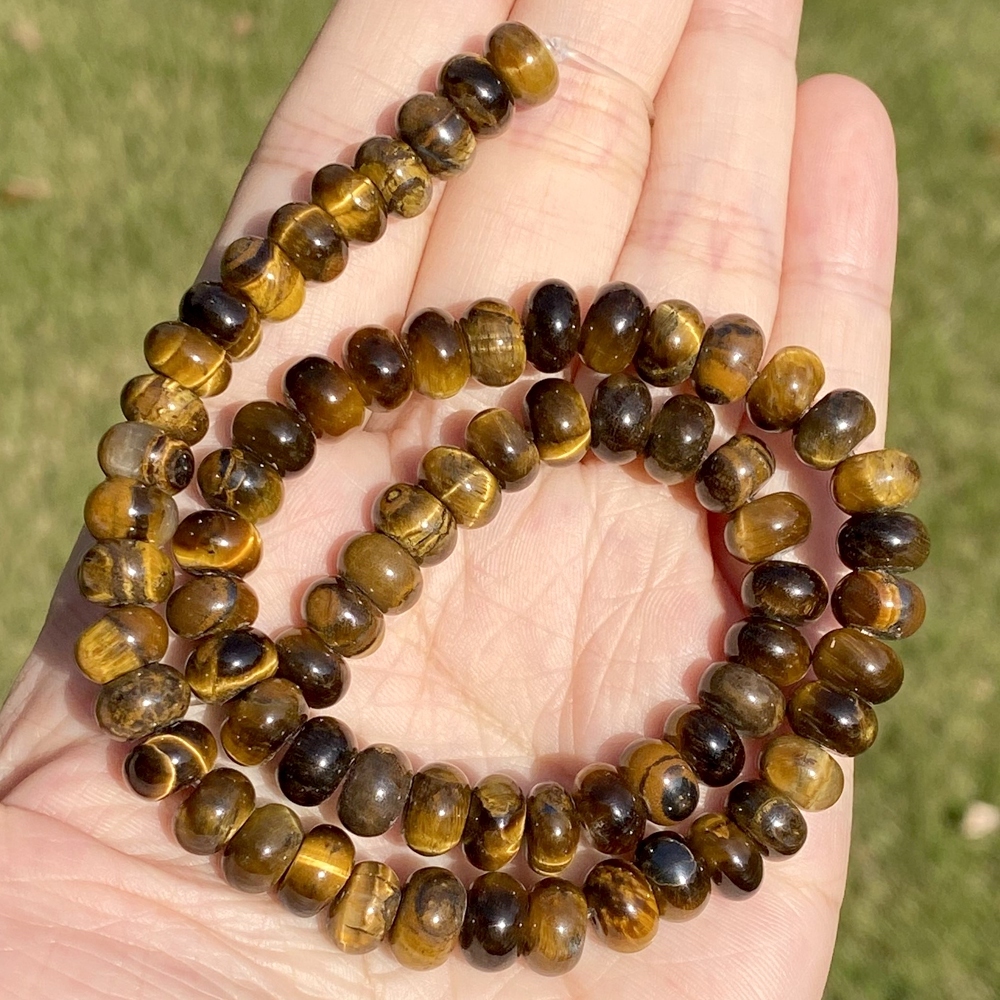 Perles jaunes de rondelle d'oeil de tigre de 4mm