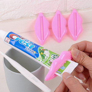 Dispensador de pasta de dientes montado en la pared, de plástico, para uso infantil, color aleatorio - Product Image 1