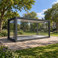 Serre en verre préfabriquée, pièce de jardin modulaire avec structure en acier et murs vitrés pour usage extérieur