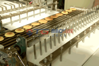 Machine de fabrication de gâteaux Dora haute technique TG Machine à tarte en pâte de haricots Ligne de crêpes Dorayaki à vendre