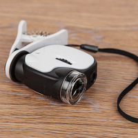 Mini microscope portable 55X avec 2 LED et 1 UV, loupe au design noir et blanc pour usage domestique