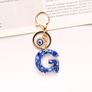 Porte-clés avec lettres œil <span class=keywords><strong>du</strong></span> <span class=keywords><strong>diable</strong></span> en résine, pendentif avec lettres, pendentif, ornement suspendu pour femmes, vente en gros et à chaud - Product Image 2