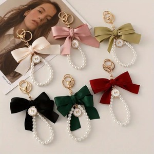 Élégant Mignon Arc Sac Charme Faux Perle Perlé Bracelet Téléphone Longe Sangle De Voiture Marque Porte-clés Cadeaux Fête Des Mères