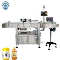 Aplicador Automático de Etiquetas Envolventes para Botellas Redondas, Frascos de PET, Recipientes de Vidrio, Cosméticos |   Equipo de Etiquetado SKILT