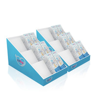 Boîte de présentation promotionnelle de comptoir de pharmacie en PVC moderne personnalisée pour les produits de soin de la peau pour bébés, design en chevron pour les magasins