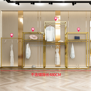 Tùy Chỉnh Thép Không Gỉ Vải Hiển Thị Đứng Phụ Nữ Quần Áo Hiển Thị Kệ Kim Loại Bán Lẻ Boutique Vàng Tường Quần Áo Giá - Product Image 3