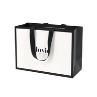 Nouveau design de décoration de Noël Sac à provisions en papier imprimé personnalisé avec poignée en ruban pour boutique de cadeaux