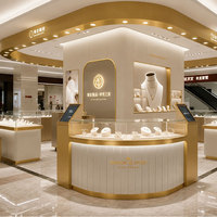 Comptoir de présentation de bijoux en verre blanc et or de luxe avec éclairage LED pour magasin de détail haut de gamme