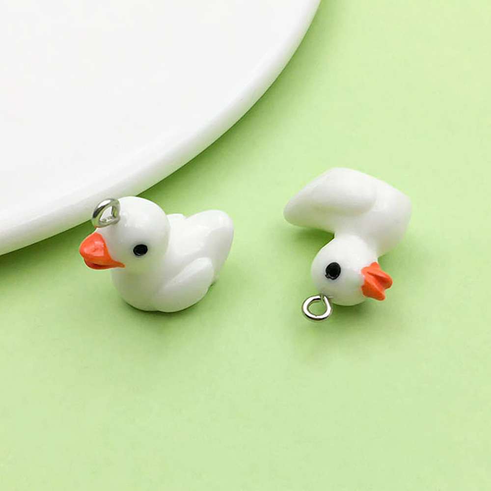 Un patito de resina blanca, 17*19 mm, 1,9 g, 17218