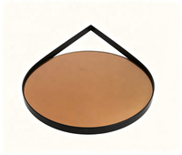 Miroir mural géométrique moderne avec verre teinté ambre et cadre en métal noir pour la décoration murale de la chambre, du salon ou de l'hôtel