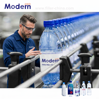 Machine de remplissage automatique de bouteilles en verre pour eau pure et lait, marque Mordern, 3500 kg, multi-tension (380V/110V/415V/220V)