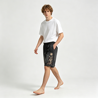Shorts noirs délavés style vintage avec broderie cactus et soleil, tissu doux au toucher, streetwear décontracté d'été