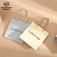 Sac d'emballage de bijoux en papier de luxe fait main avec logo personnalisé, poignée en ruban, sac cadeau écologique pour colliers, bagues, boucles d'oreilles