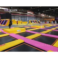 Parc de trampolines intérieur commercial pour enfants et adultes, centre de divertissement et d'exercice en libre style avec fosse à mousse et obstacles ninja