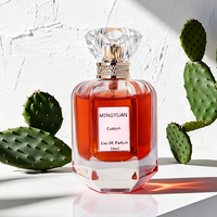 Flacon de parfum hexagonal en verre transparent de luxe 70 ml avec pompe pulvérisatrice, bouchon en acrylique sérigraphié, emballage en boîte cadeau cylindrique