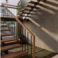 Escalier central moderne pour résidence de luxe avec structure sur mesure et balustrade en verre
