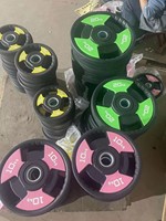Ensemble de plaques de musculation en fonte à trois trous personnalisables pour usage commercial en salle de sport, 25 kilogrammes, design simple et durable antidérapant