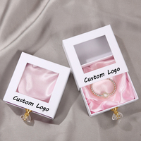 Boîte à bijoux en carton avec logo personnalisé, tiroir, fenêtre en PVC pour colliers, boucles d'oreilles, bracelets, boîte à bijoux avec poignée en cristal