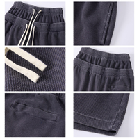 Shorts de survêtement unisexe en tissu gaufré délavé, à double ceinture extensible avec cordon de serrage ajustable