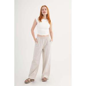Pantalons palazzo tendance en gros pour femmes, pantalons à bordure en pierre avec taille élastique et détails de l'ourlet, poches, style formel - Product Image 4