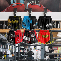 Vente en gros Short de Muay Thai en soie à haute élasticité Logo personnalisé Impression par sublimation Conception assortie Ensemble familial pour hommes boxe