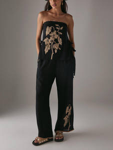 กางเกงขายาวลำลองแฟชั่นผู้หญิงทรงหลวมลายดอกไม้ปักลายปะติด ระบายอากาศได้ดี เอวกลาง มีเชือกผูก ผลิตจากผ้าฝ้าย 100% - Product Image 2